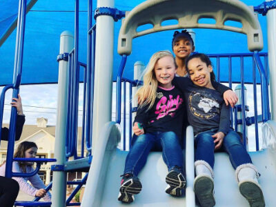 Girls Posing together on a slide